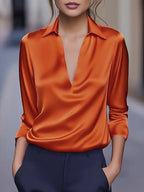 Draped neck long sleeve blouse in orange