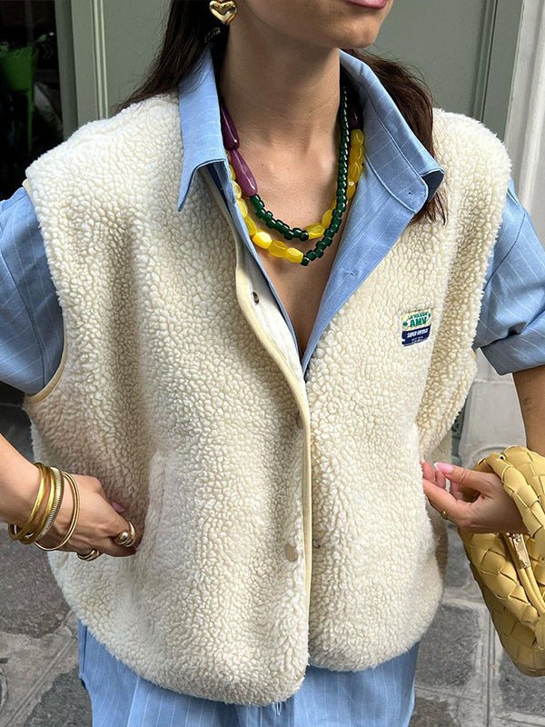 Lambswool vest with button front in slim fit, showcasing a stylish design and cozy texture, perfect for layering in cooler weather. 0