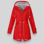 Women's sleek waterproof rain jacket with adjustable hood in red