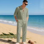 Men's business casual outfit featuring a lightweight linen shirt and matching trousers, perfect for warm weather and professional settings. 2