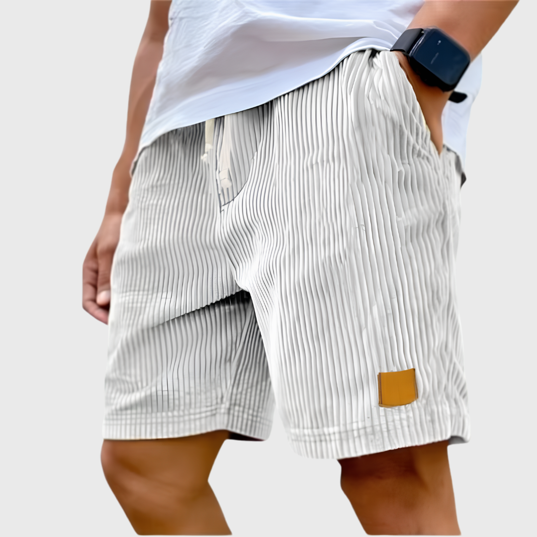Men's relaxed fit textured summer shorts in a light color, perfect for casual occasions. Featuring a comfortable waistband and stylish design, ideal for warm weather outings 1