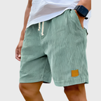 Men's relaxed fit textured summer shorts in a light color, perfect for casual occasions. Featuring a comfortable waistband and stylish design, ideal for warm weather outings 3
