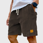 Men's relaxed fit textured summer shorts in a light color, perfect for casual occasions. Featuring a comfortable waistband and stylish design, ideal for warm weather outings 8