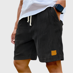 Men's relaxed fit textured summer shorts in a light color, perfect for casual occasions. Featuring a comfortable waistband and stylish design, ideal for warm weather outings 9