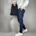 Men's slim fit cargo joggers featuring ribbed cuffs, designed for stylish casual wear, showcasing a modern silhouette and practical pockets. 2