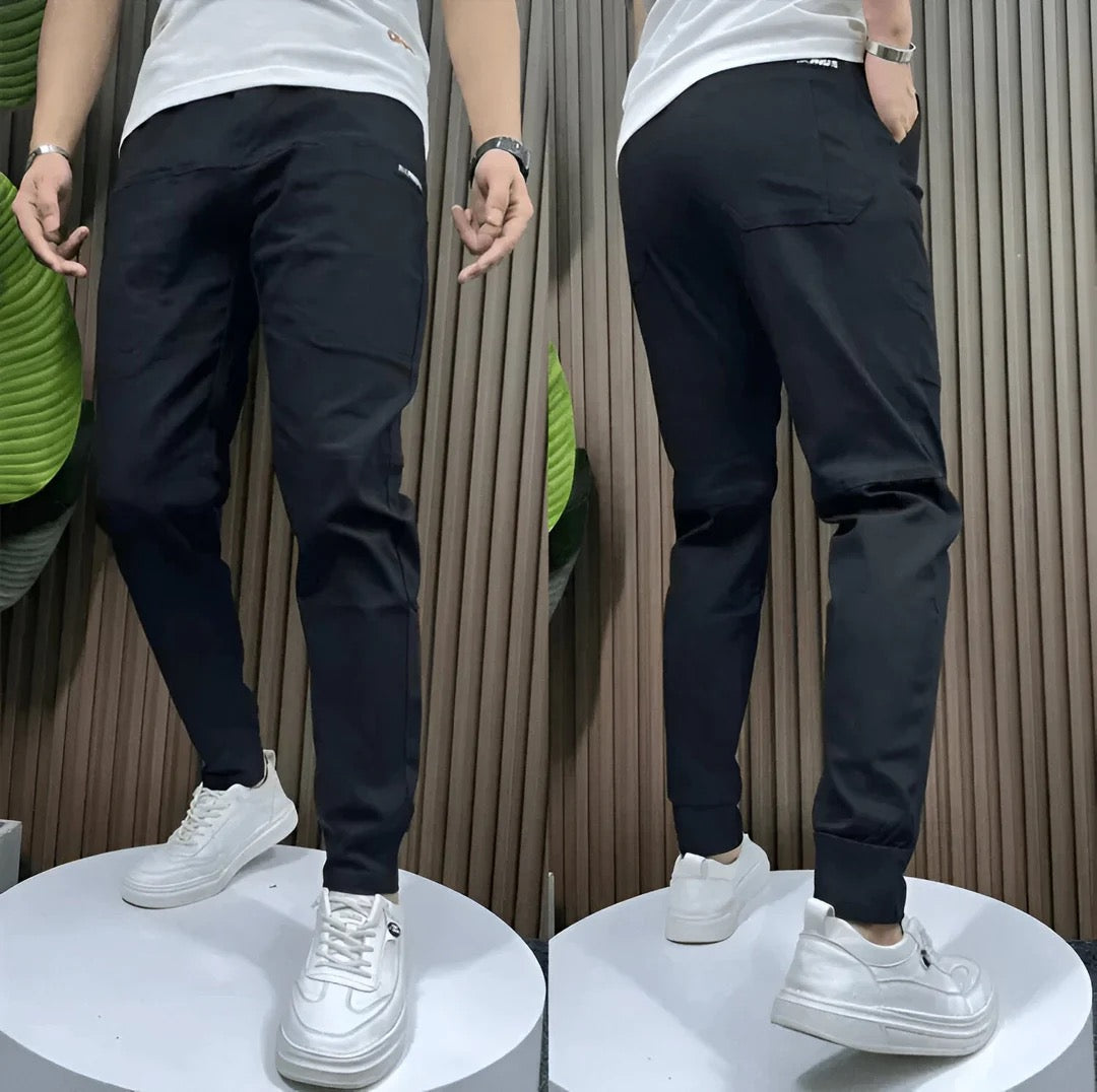 Men's slim fit cargo joggers featuring ribbed cuffs, designed for stylish casual wear, showcasing a modern silhouette and practical pockets. 3