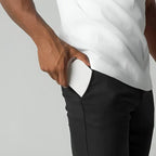Men's tapered chino pants designed for versatility, perfect for work or casual outings, featuring a modern fit and comfortable fabric. 2