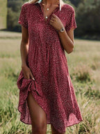 Midi shirt dress featuring short sleeves and a fluid silhouette, perfect for casual or semi-formal occasions. 1