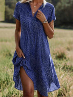 Midi shirt dress featuring short sleeves and a fluid silhouette, perfect for casual or semi-formal occasions. 2