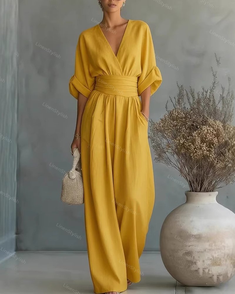 V-Neck jumpsuit for women featuring a tailored fit and luxurious silk-touch fabric, perfect for elegant occasions and stylish outings. 11