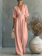 V-Neck jumpsuit for women featuring a tailored fit and luxurious silk-touch fabric, perfect for elegant occasions and stylish outings. 12
