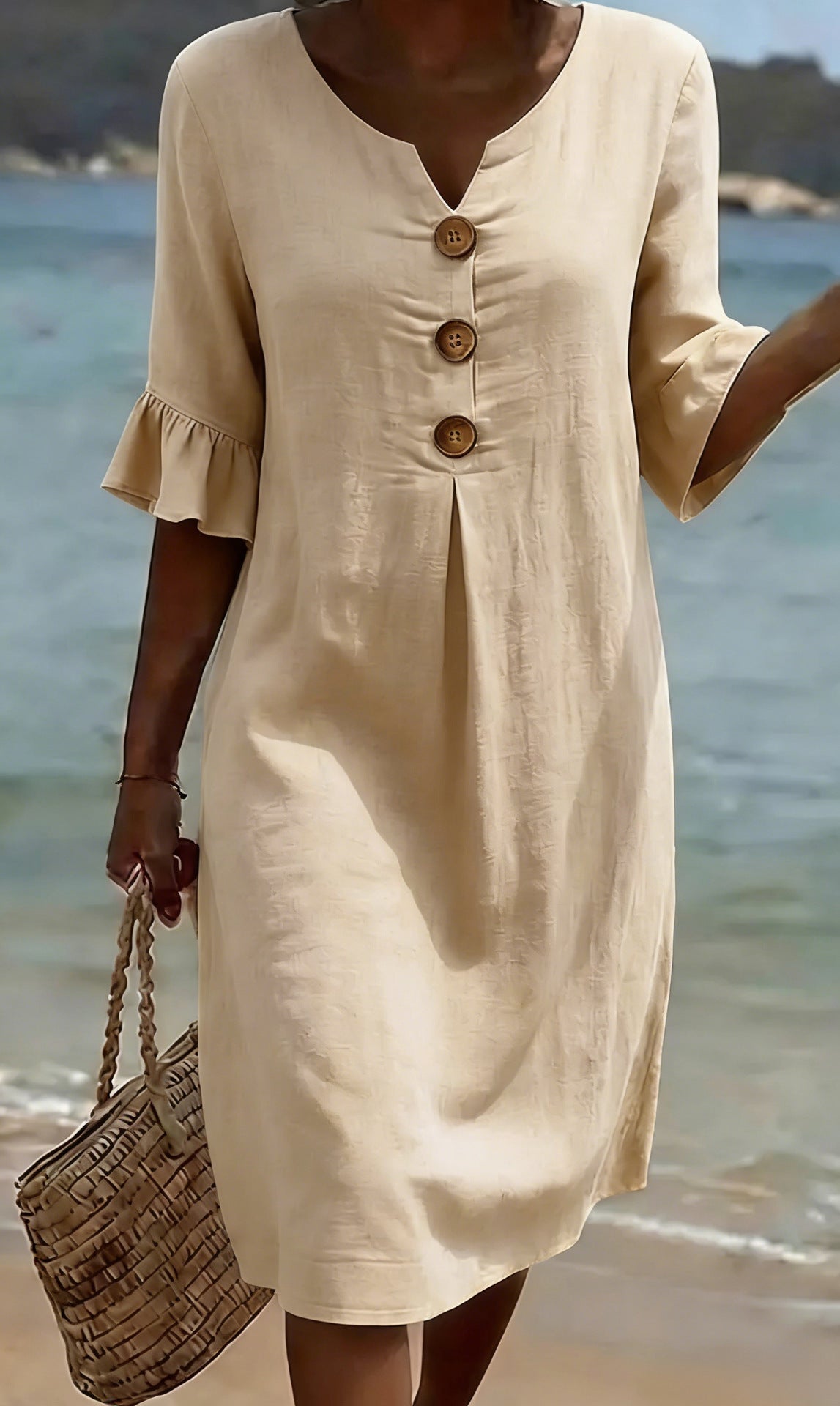 White summer dress featuring ruffled sleeves, made from a soft cotton-linen blend, perfect for warm weather outings and casual occasions. 10