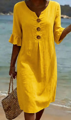 White summer dress featuring ruffled sleeves, made from a soft cotton-linen blend, perfect for warm weather outings and casual occasions. 6