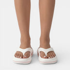 Women's anatomical flip flops designed for summer beach casual wear, featuring ergonomic footbeds for comfort and stylish designs in vibrant colors. 1