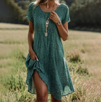 Plus size women's boho maxi dress in a loose fit, perfect for summer casual wear, featuring vibrant patterns and a flowy silhouette. 1