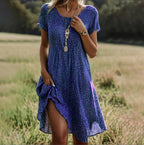 Plus size women's boho maxi dress in a loose fit, perfect for summer casual wear, featuring vibrant patterns and a flowy silhouette. 2