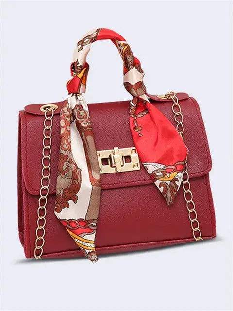 Elegant women's classic leather handbag designed for everyday use, featuring a compact design that combines style and functionality. 1
