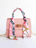 Elegant women's classic leather handbag designed for everyday use, featuring a compact design that combines style and functionality. 5