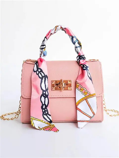 Elegant women's classic leather handbag designed for everyday use, featuring a compact design that combines style and functionality. 5