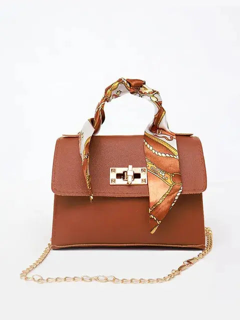 Elegant women's classic leather handbag designed for everyday use, featuring a compact design that combines style and functionality. 7