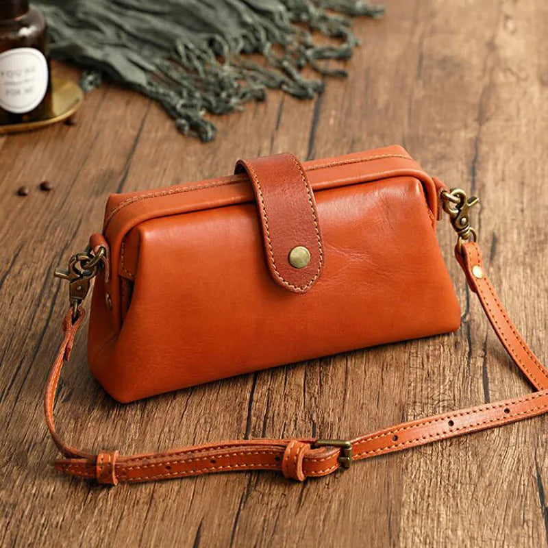 Women's compact adjustable crossbody bag featuring a stylish magnetic flap closure, perfect for hands-free convenience and organized storage. 0