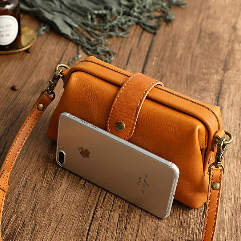 Women's compact adjustable crossbody bag featuring a stylish magnetic flap closure, perfect for hands-free convenience and organized storage. 2