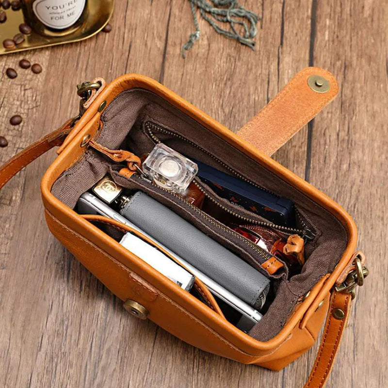 Women's compact adjustable crossbody bag featuring a stylish magnetic flap closure, perfect for hands-free convenience and organized storage. 3