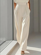 Women's elegant wide leg jumpsuit in a sophisticated design, perfect for formal occasions, featuring a flattering silhouette and stylish details. 2