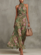 Women's flowy halter neck floral summer dress featuring vibrant blooms, a comfortable fit, and a breezy silhouette, perfect for warm weather outings. 0