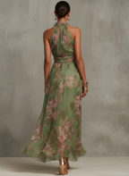 Women's flowy halter neck floral summer dress featuring vibrant blooms, a comfortable fit, and a breezy silhouette, perfect for warm weather outings. 1