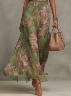 Women's flowy halter neck floral summer dress featuring vibrant blooms, a comfortable fit, and a breezy silhouette, perfect for warm weather outings. 3