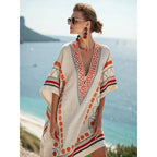 Women's flowy kaftan dress in a vibrant summer print, perfect for beach outings and casual gatherings. 0