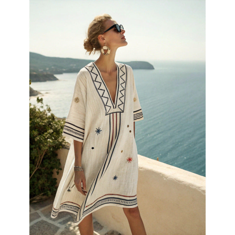Women's flowy kaftan dress in a vibrant summer print, perfect for beach outings and casual gatherings. 1