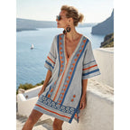 Women's flowy kaftan dress in a vibrant summer print, perfect for beach outings and casual gatherings. 10