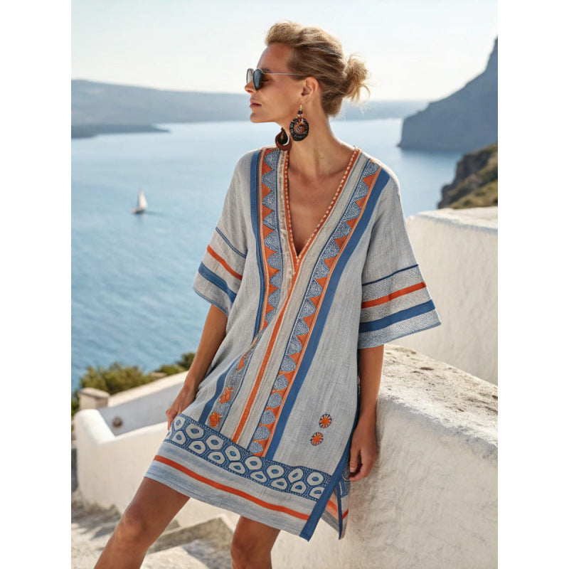 Women's flowy kaftan dress in a vibrant summer print, perfect for beach outings and casual gatherings. 10