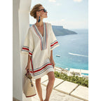 Women's flowy kaftan dress in a vibrant summer print, perfect for beach outings and casual gatherings. 2