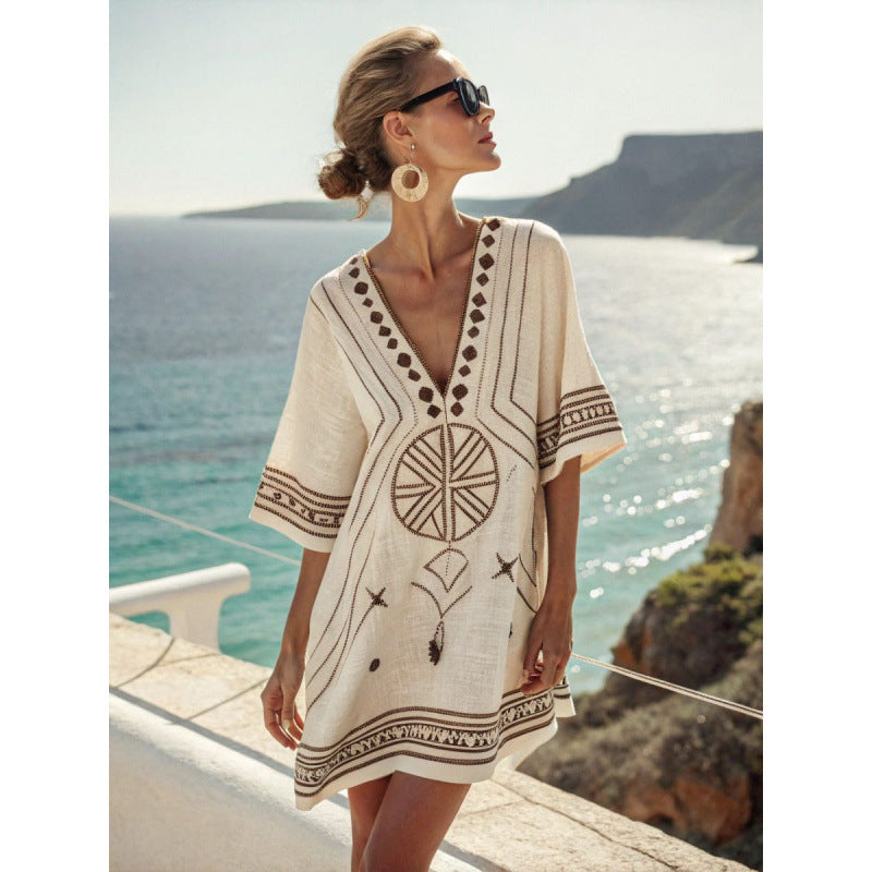 Women's flowy kaftan dress in a vibrant summer print, perfect for beach outings and casual gatherings. 8