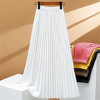 Women's high-waisted pleated maxi skirt in elegant fabric, perfect for casual and formal occasions, showcasing a flowy silhouette and versatile styling options. 1