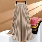 Women's high-waisted pleated maxi skirt in elegant fabric, perfect for casual and formal occasions, showcasing a flowy silhouette and versatile styling options. 4