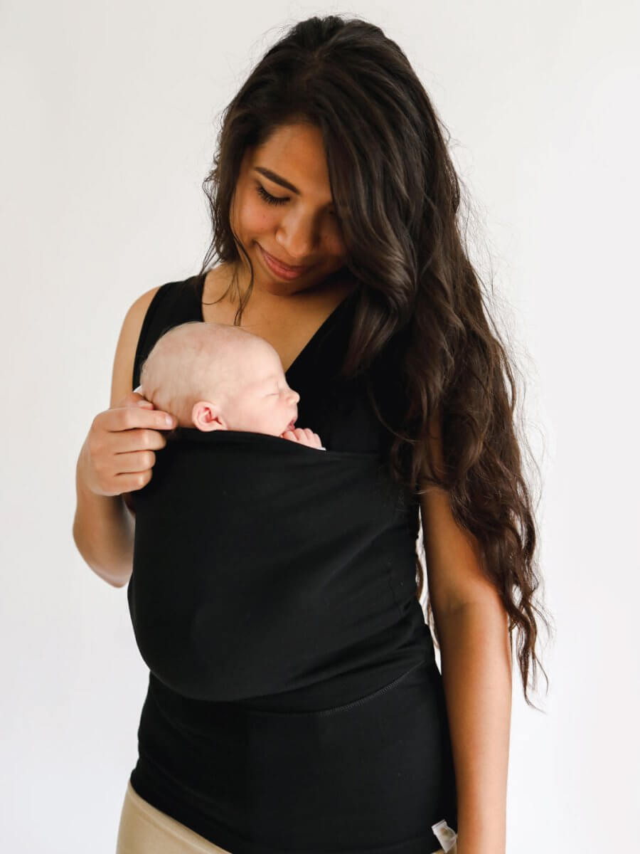 Women's kangaroo pocket baby carrier shirt designed for parenting activities, featuring a comfortable and stylish design, perfect for hands-free baby carrying and nurturing. 0