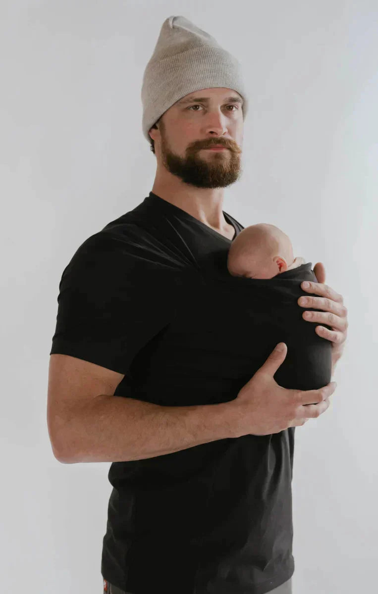 Women's kangaroo pocket baby carrier shirt designed for parenting activities, featuring a comfortable and stylish design, perfect for hands-free baby carrying and nurturing. 1