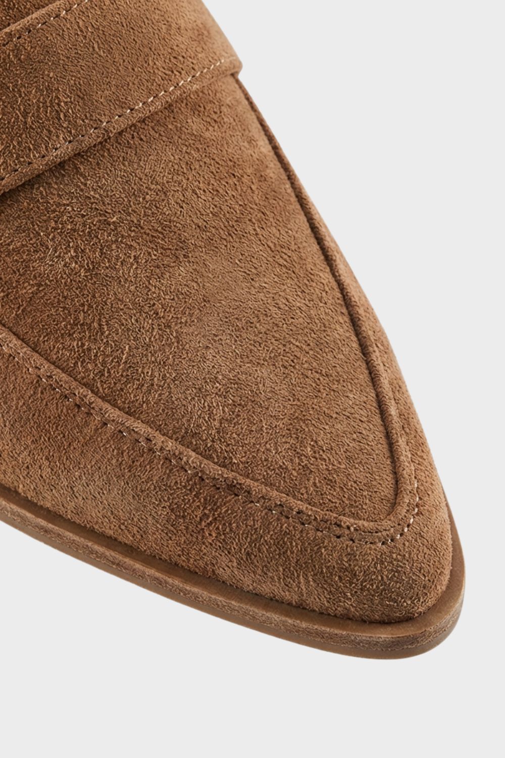 Women's pointed penny loafers featuring a stylish block heel, perfect for everyday wear and versatile enough for both casual and formal outfits. 1