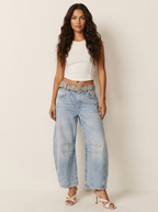 Women's relaxed fit barrel jeans featuring a high waist design, perfect for casual wear with a stylish and comfortable silhouette. 3