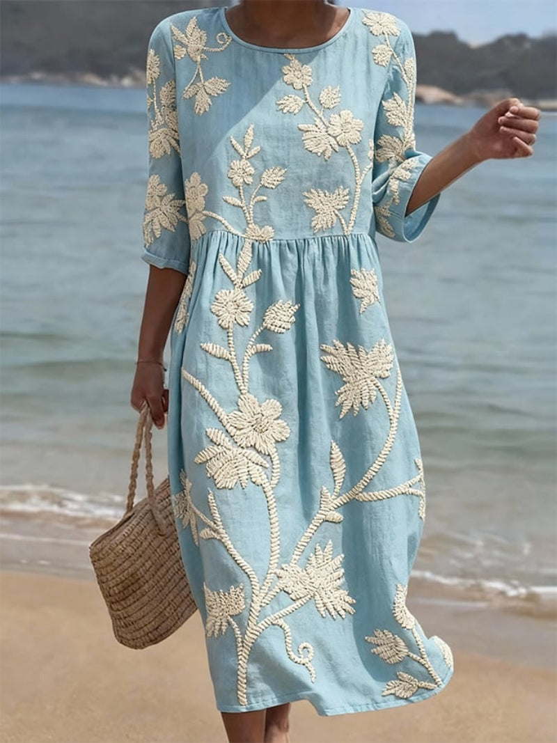 Women's relaxed fit embroidered midi dress perfect for summer occasions, featuring delicate floral patterns and a comfortable, breathable fabric ideal for warm weather. 0