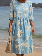 Women's relaxed fit embroidered midi dress perfect for summer occasions, featuring delicate floral patterns and a comfortable, breathable fabric ideal for warm weather. 1