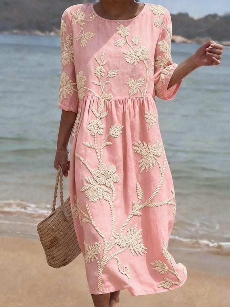 Women's relaxed fit embroidered midi dress perfect for summer occasions, featuring delicate floral patterns and a comfortable, breathable fabric ideal for warm weather. 2