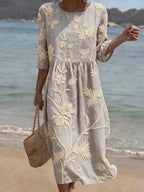 Women's relaxed fit embroidered midi dress perfect for summer occasions, featuring delicate floral patterns and a comfortable, breathable fabric ideal for warm weather. 5