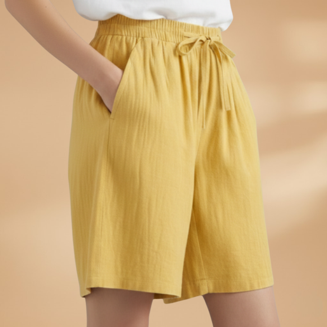 Women's relaxed fit knee-length shorts in a stylish design, perfect for casual outings and summer wear. 3
