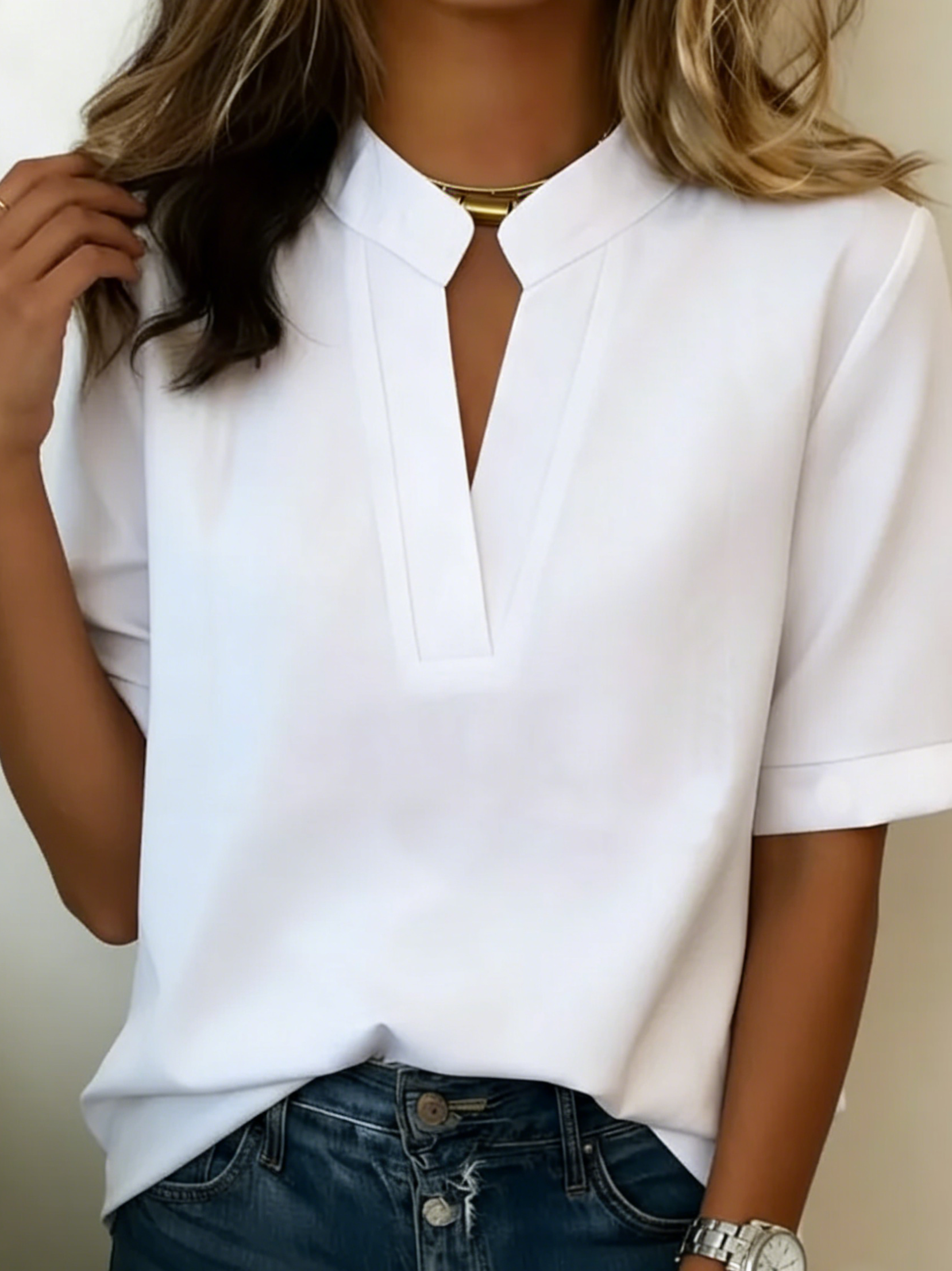 Women's relaxed fit V-neck blouse in a lightweight fabric, perfect for summer wear, featuring short sleeves and a comfortable, casual style ideal for everyday outfits. 7