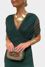 Women's ruched V-neck maxi dress in a vibrant color, perfect for summer formal occasions, featuring elegant flowing fabric and a flattering silhouette. 11